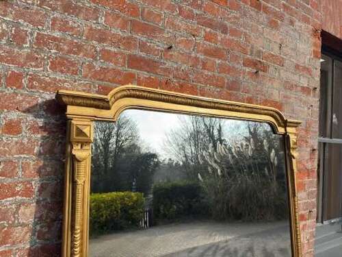 An Exceptional large Antique English 19th Century gilt ribbed Overmantle Mirror.