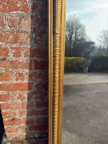 An Exceptional large Antique English 19th Century gilt ribbed Overmantle Mirror.