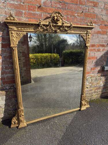A Spectacular large Antique English 19th Century gilt Overmantel Mirror.