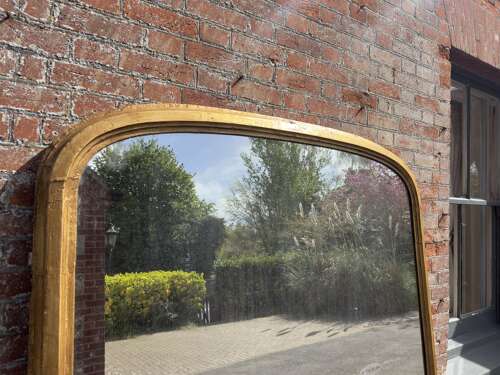 An Exceptional large Antique English 19th Century arched top gilt Overmantel Mirror.