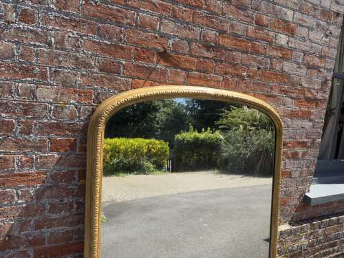 A Stunning large Antique English 19th Century arched top gilt Overmantle Mirror.