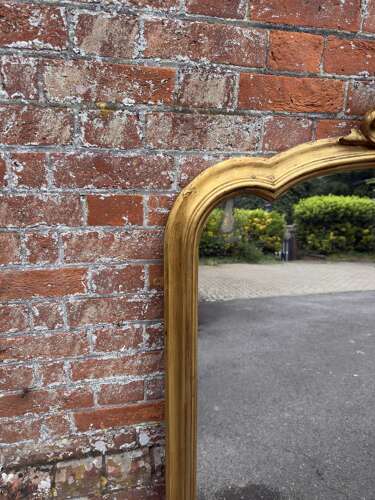 A large Antique English 19th Century shaped top gilt Overmantle Mirror,