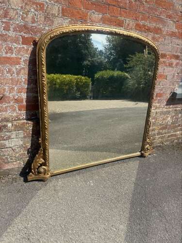 A Fabulous large Antique English 19th C gilt arched top Overmantle Mirror.