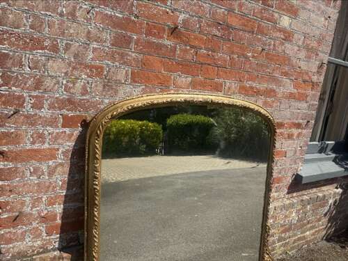 A Fabulous large Antique English 19th C gilt arched top Overmantle Mirror.