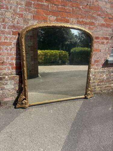 A Fabulous large Antique English 19th C gilt arched top Overmantle Mirror.