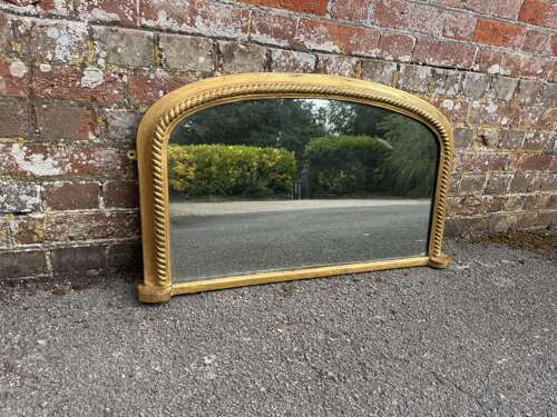 A Delightful good size Antique English 19th C arched top gilt ribbed Overmantle Mirror.