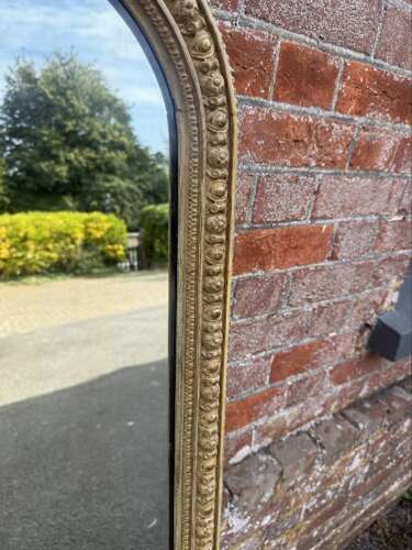 A Delightful large Antique English 19th C arched top gilt Overmantle Mirror.