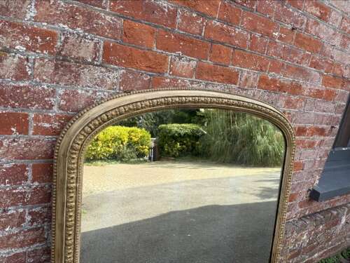 A Delightful large Antique English 19th C arched top gilt Overmantle Mirror.