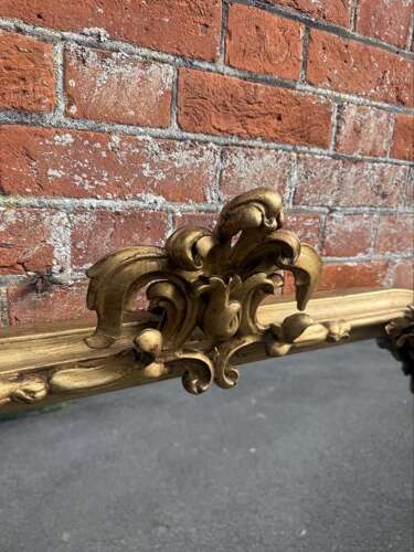 A Spectacular large Antique English 19th C shaped top gilt Overmantle Mirror.