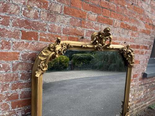 A Spectacular large Antique English 19th C shaped top gilt Overmantle Mirror.