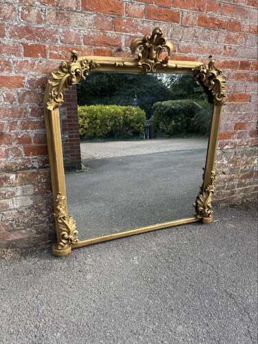 A Spectacular large Antique English 19th C shaped top gilt Overmantle Mirror.