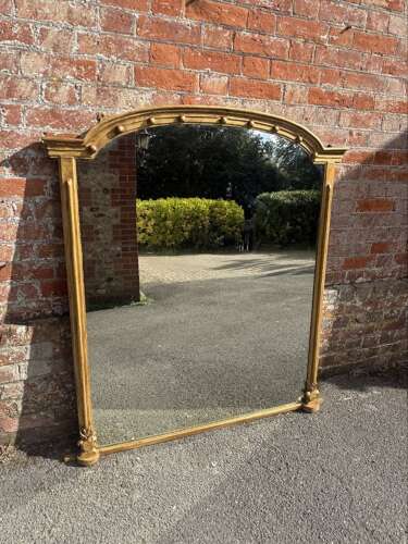 A Delightful large Antique English 19th Century arched top gilt Overmantle Mirror.